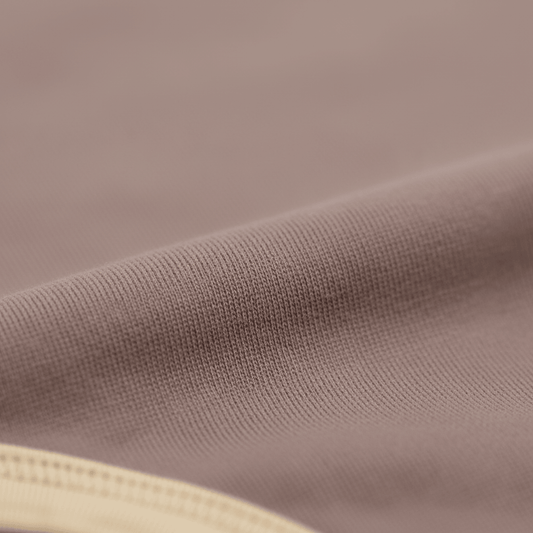 Soft organic cotton baby clothing fabric with gentle ribbed texture