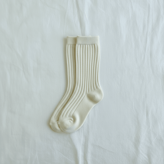 Soft ribbed baby socks in creamy white, perfect for gentle everyday wear