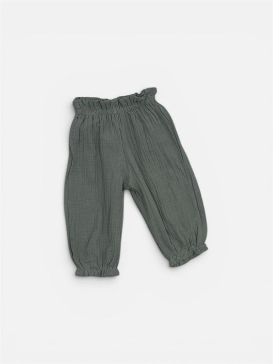 Organic sage green baby bubble pants with elastic waist and cuffs, certified breathable cotton.