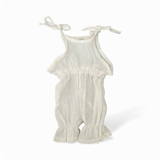 White organic cotton baby jumpsuit with tie straps and ruffled hems, certified organic baby clothing.