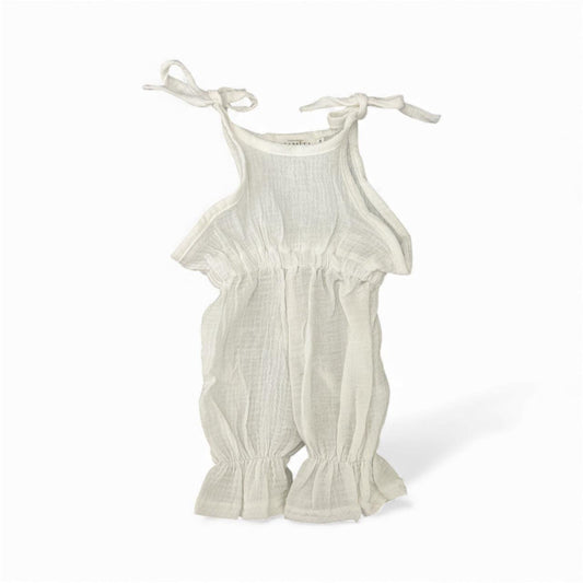 Organic cotton baby romper with tie straps and ruffled hem, soft neutral tone for newborns