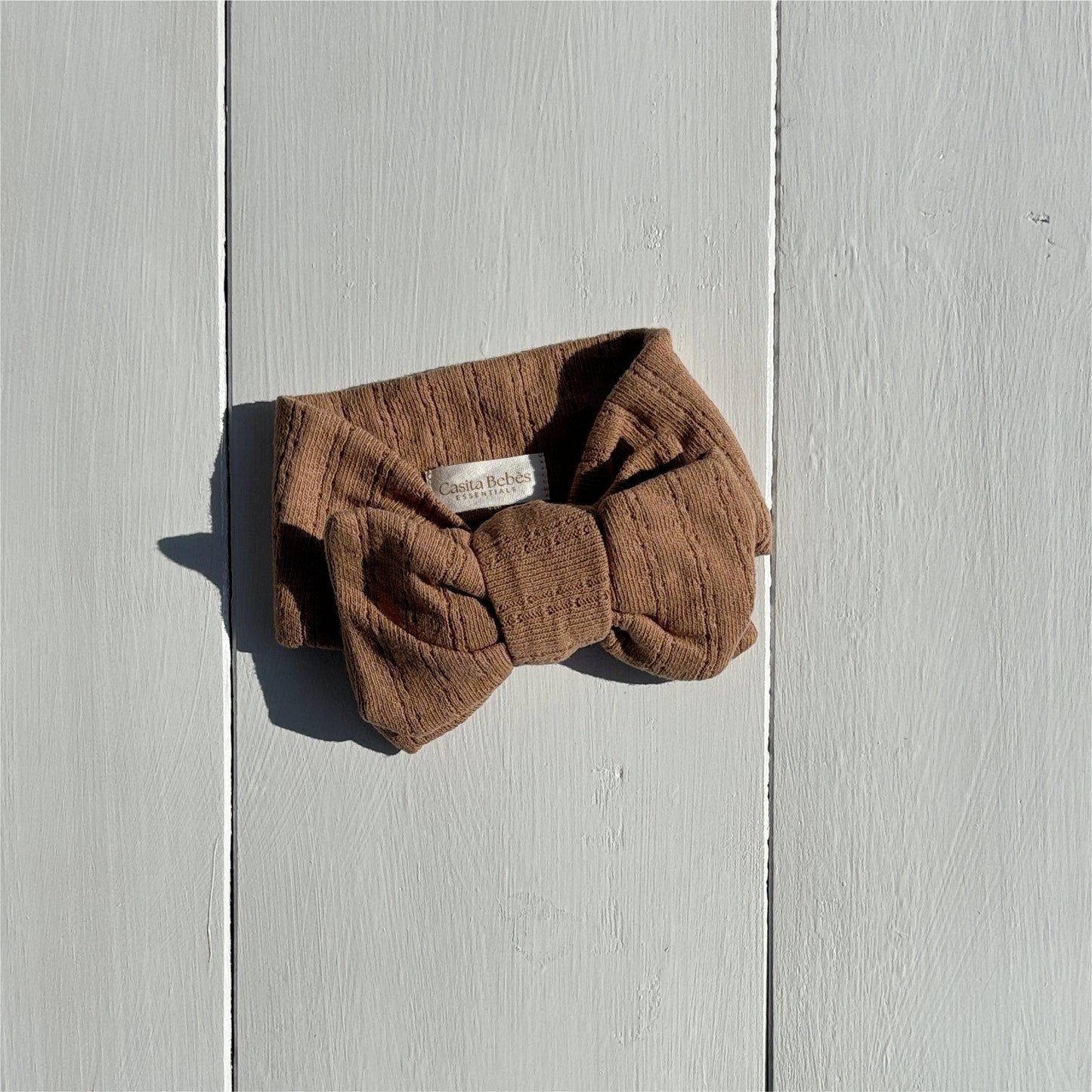 Organic baby headband with bow, soft corduroy texture, neutral brown, for newborns and infants