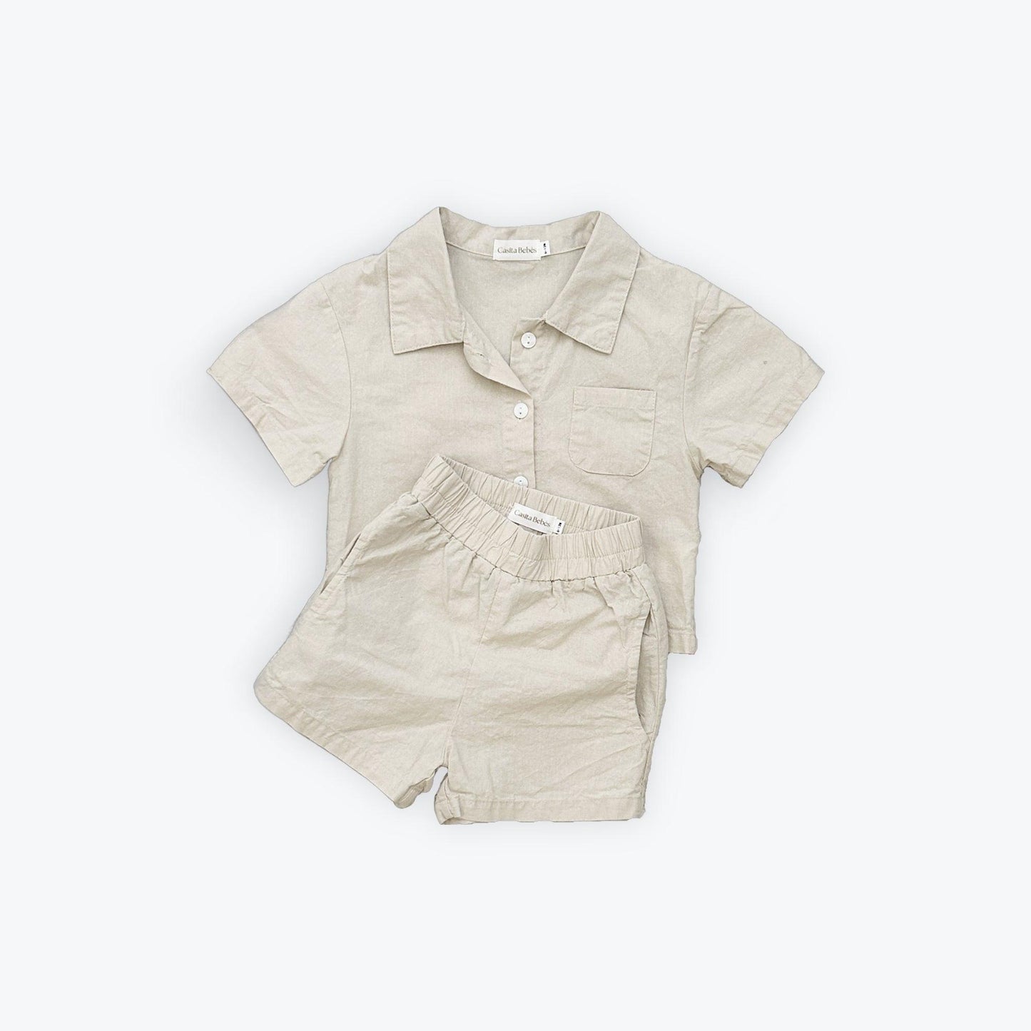Organic cotton toddler boy beige collared short-sleeve top and matching shorts set.