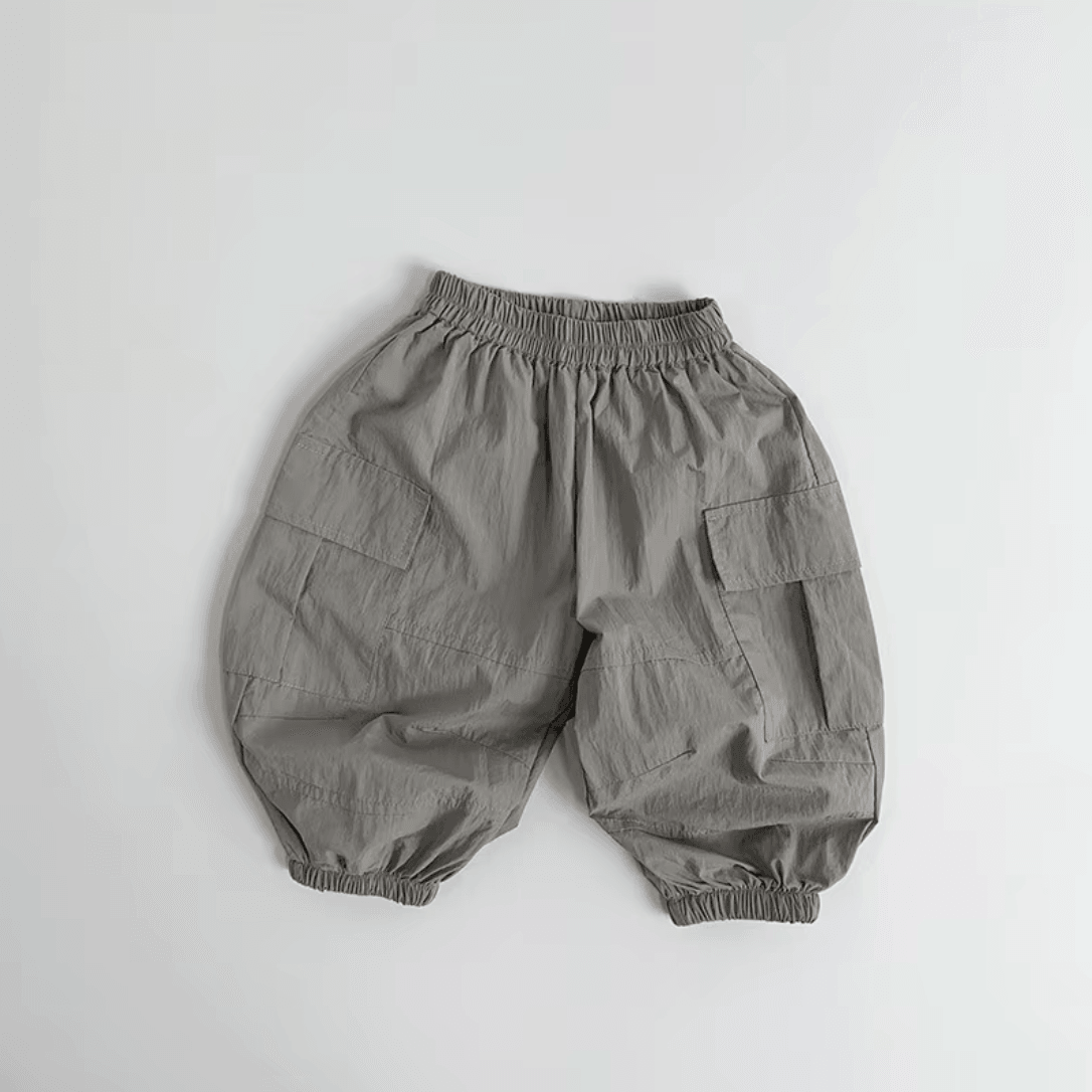Gray organic toddler pants with elastic waist and side pockets, soft fabric for everyday comfort