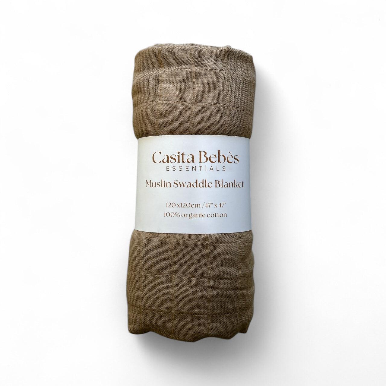 Dusty brown organic muslin swaddle blanket by Casita Bebes with certified organic cotton label.