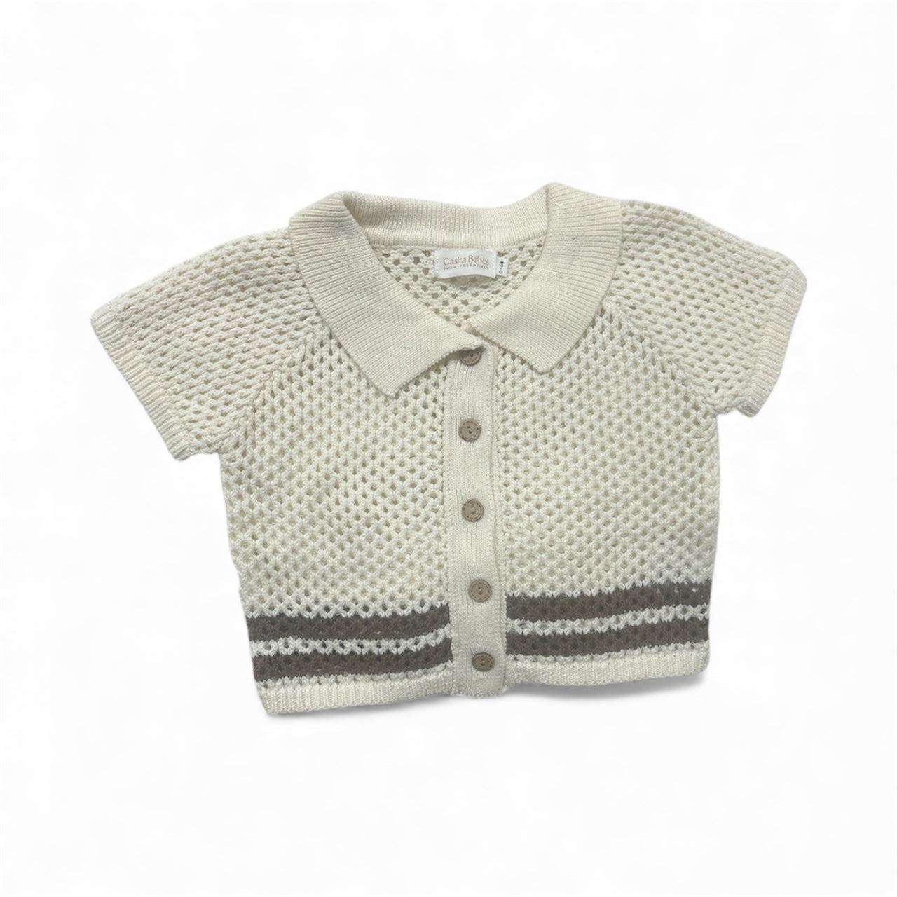 Knitted breathable baby top with buttons  on a white background