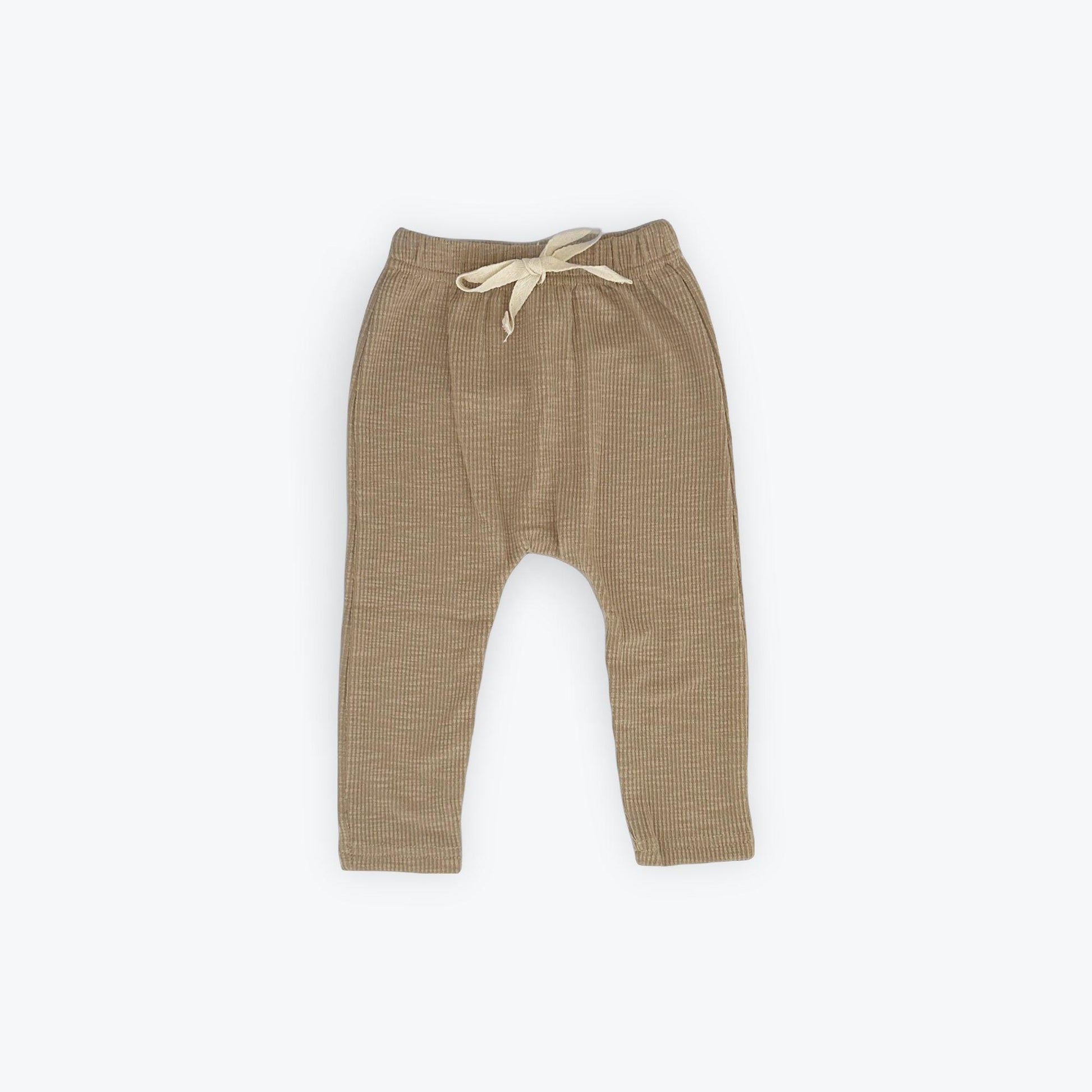 Organic cotton textured baby pants in soft tan with drawstring, certified organic baby clothing from Casita Bebes.