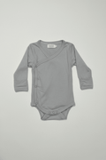 Gray baby bodysuit with wrap design on a light gray background