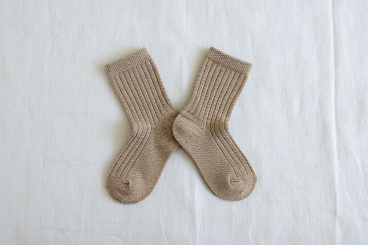 Dusty brown organic cotton ribbed baby socks flat laid, certified organic baby clothing.