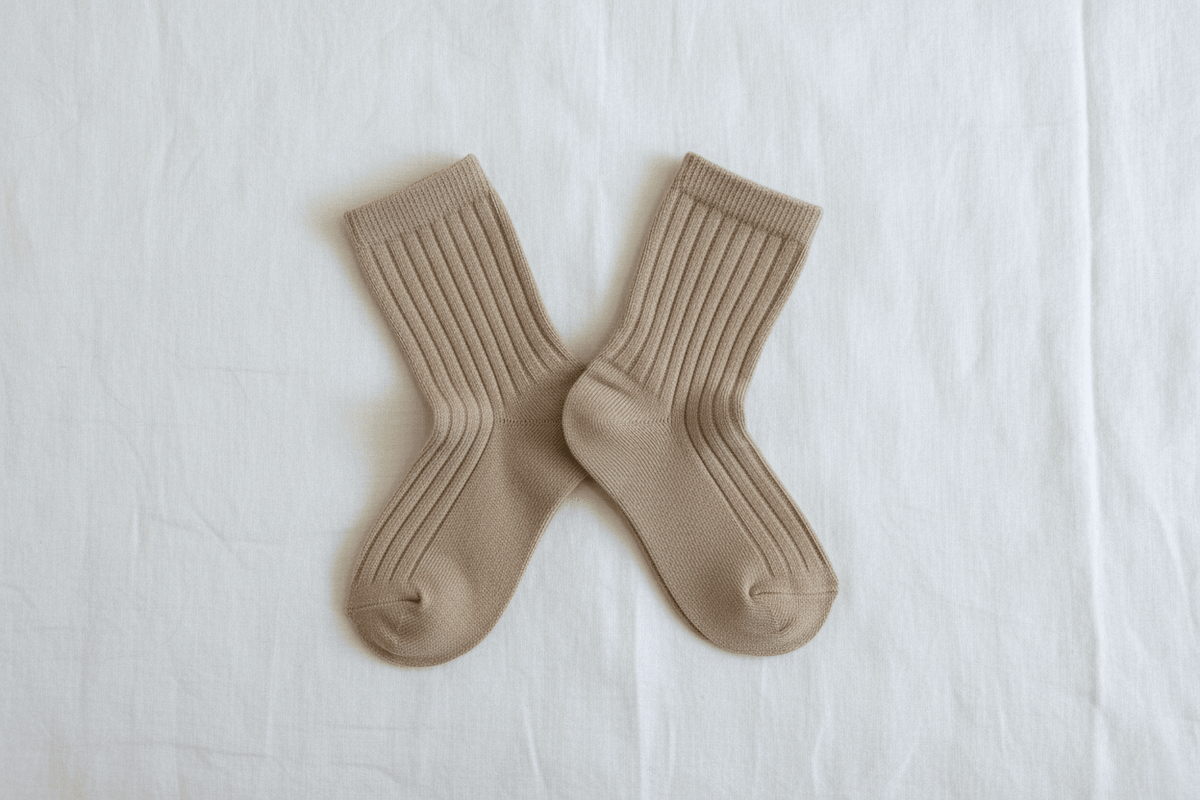 Soft ribbed baby socks in neutral beige, perfect for everyday comfort and gentle care.