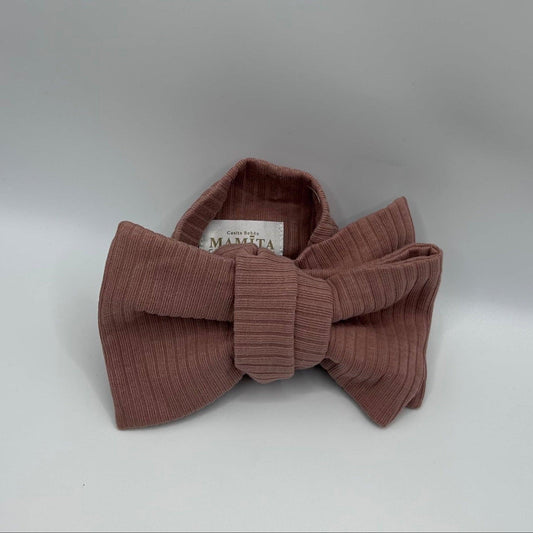 Dusty pink organic cotton baby headband with large bow from Casita Bebes, certified organic.