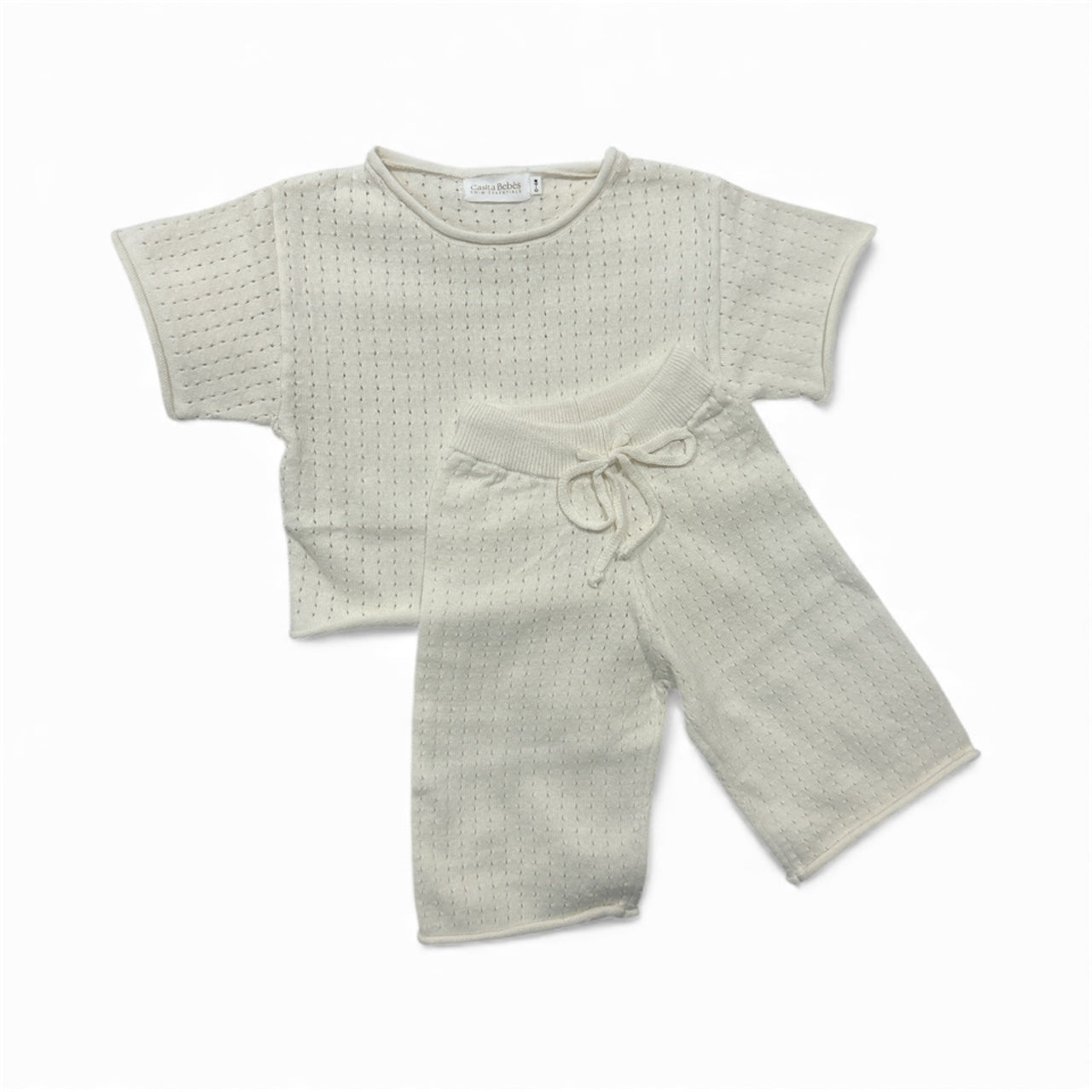 Light cream Knitted breathable textured top and shorts set on a white background