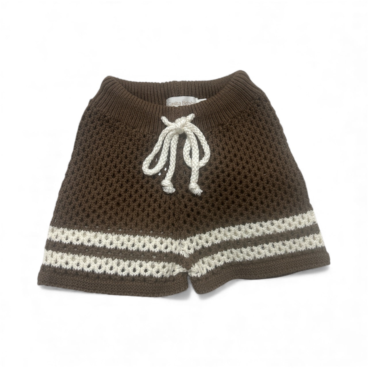 Brown and white knitted pants with drawstring on a white background