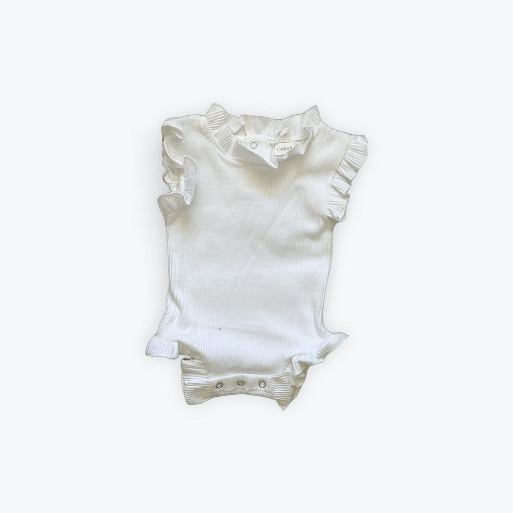 White organic baby onesie with ruffled sleeves and neckline, soft ribbed fabric for newborns
