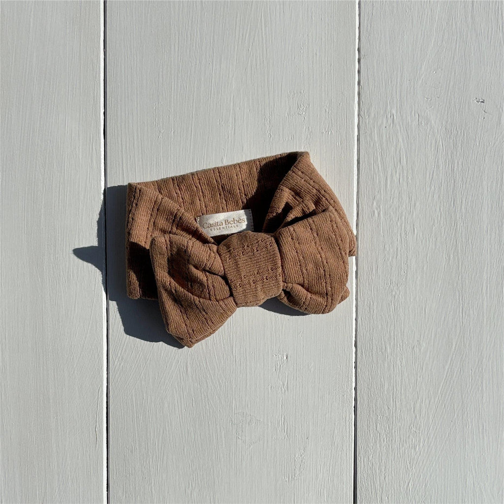 Organic baby headband with bow, soft corduroy texture, neutral brown, for newborns and infants