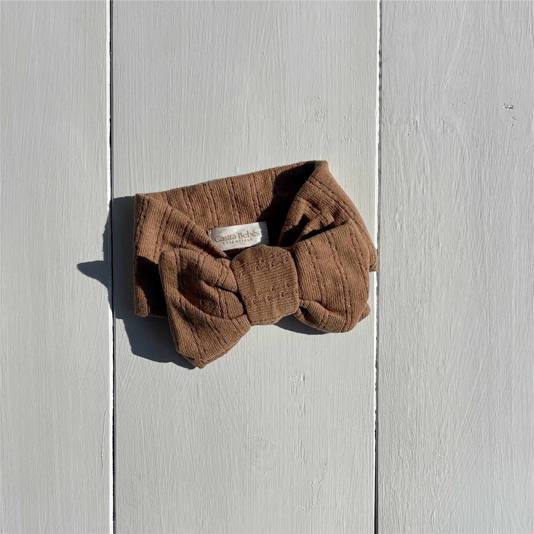 Dusty brown organic linen bow headband from Essentials Collection, certified organic baby accessory.