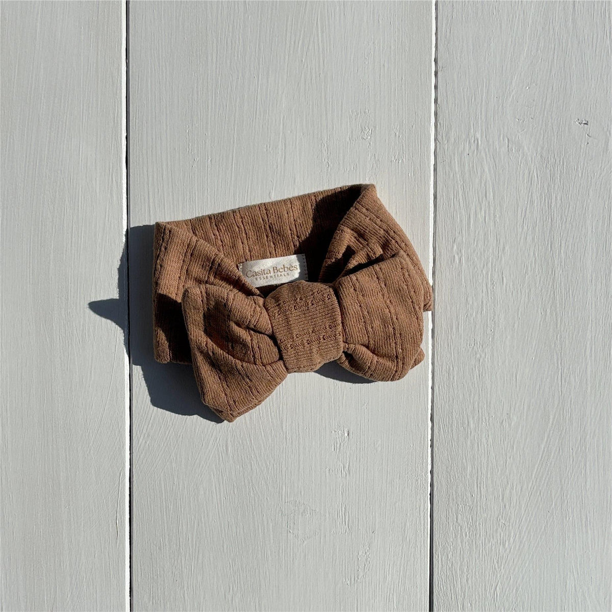 Organic baby headband with bow, soft corduroy texture, neutral brown, for newborns and infants