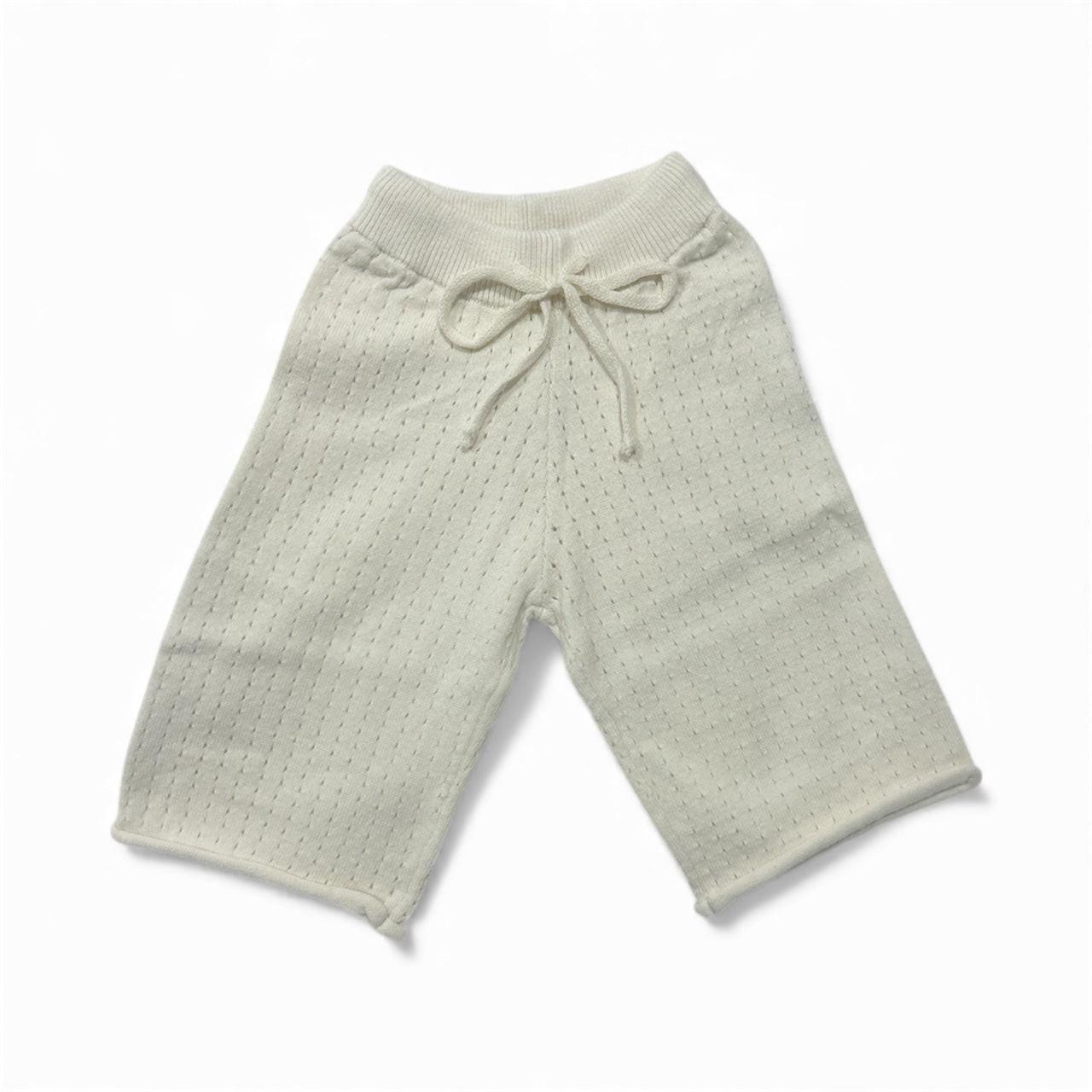 Soft organic baby pants with drawstring waist, breathable knit design for comfort