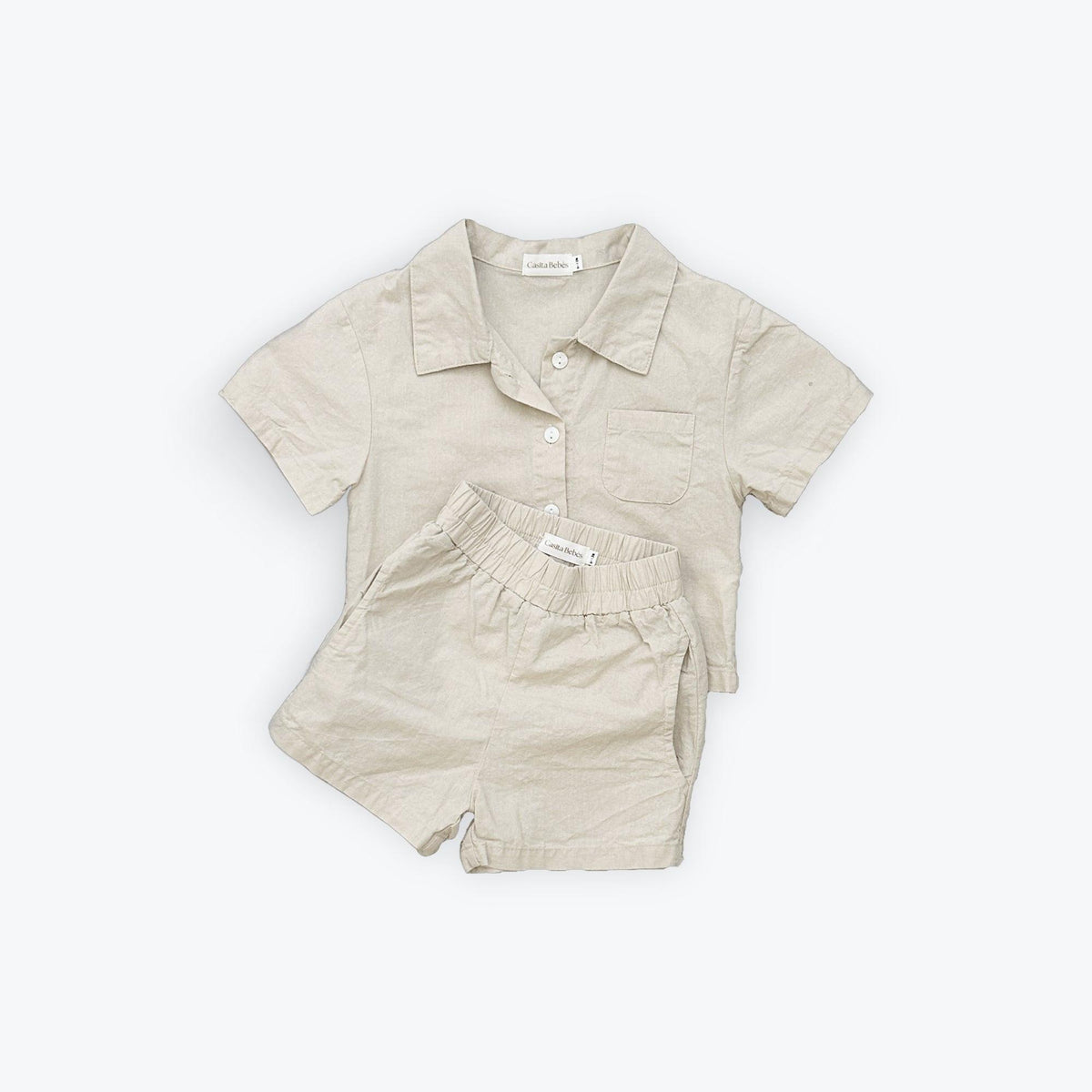 Organic baby shirt and shorts set in neutral linen, perfect for everyday comfort and gentle motherhood moments.