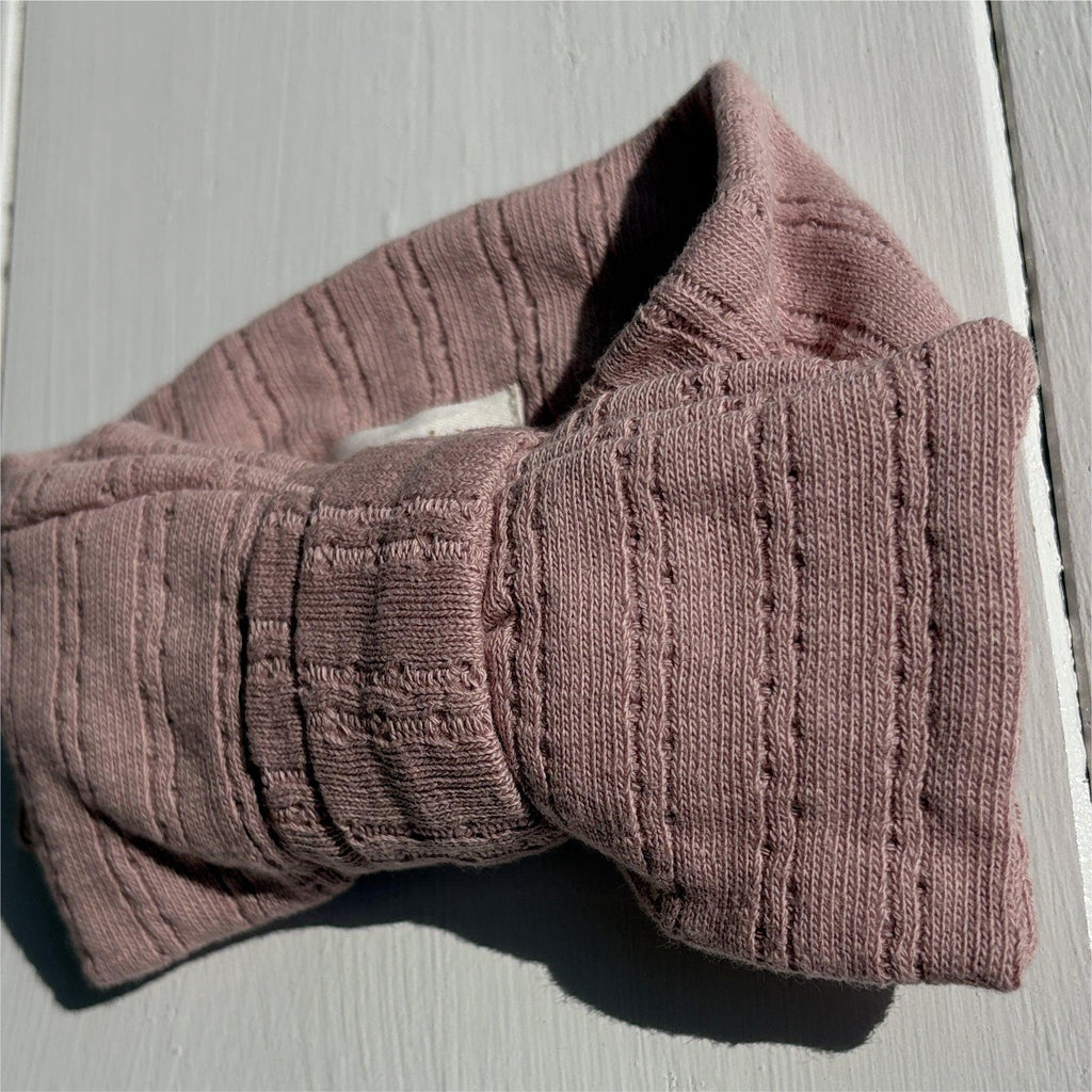 Soft organic baby knit blanket in dusty rose, cozy texture for everyday essentials