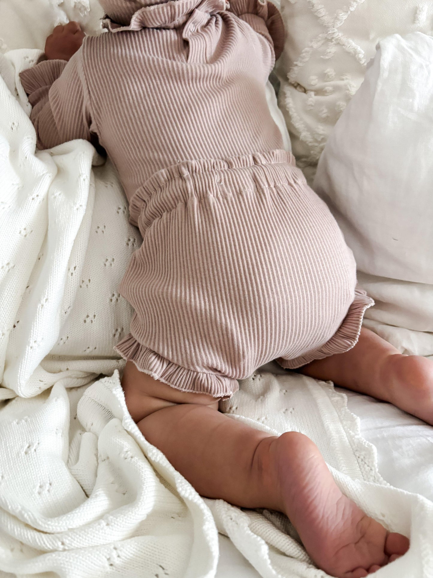 Organic dusty pink ribbed baby bloomer on crawling baby, certified organic baby clothing by Casita Bebes.