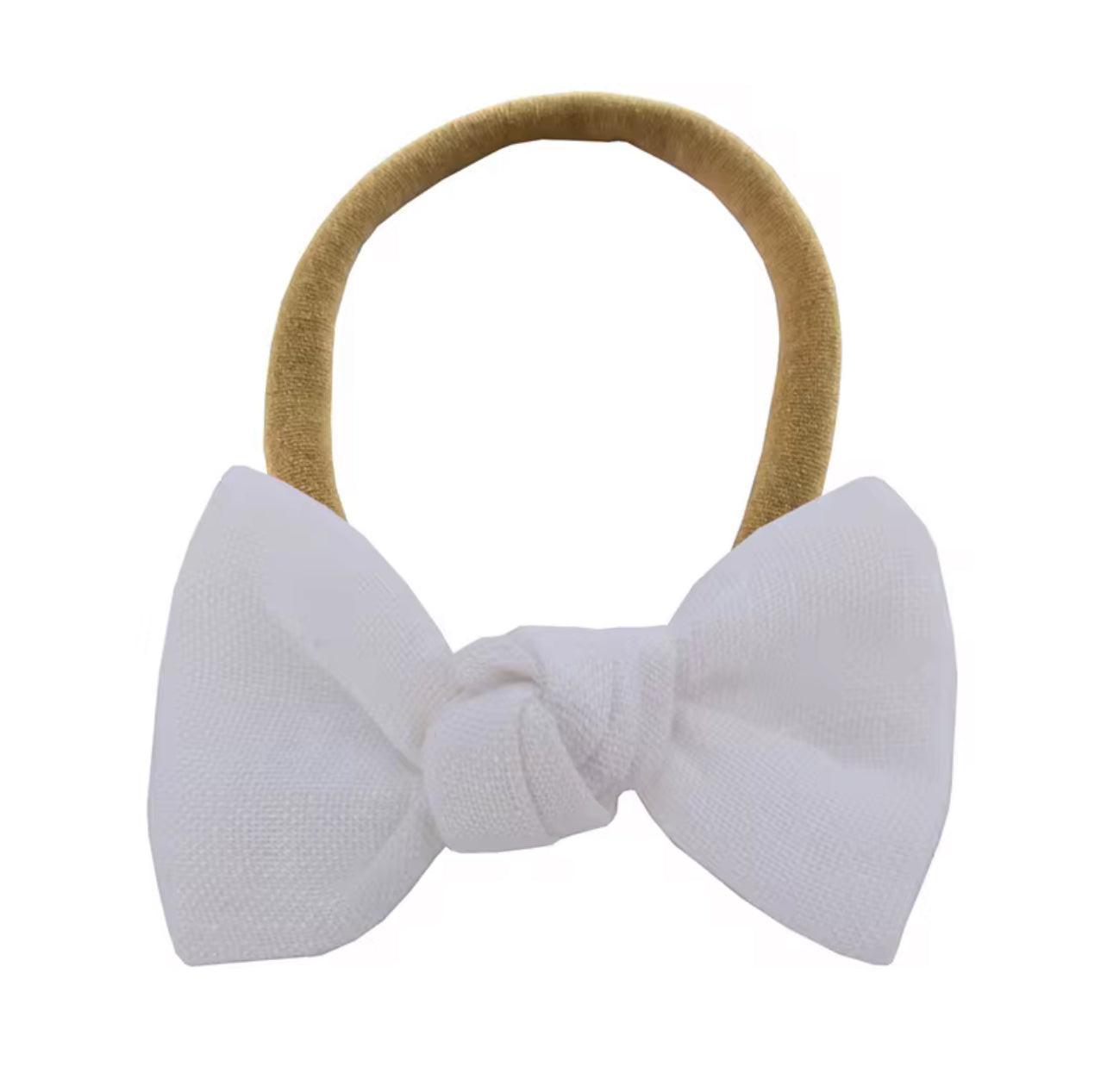 White bow headband for babies, soft organic cotton, gentle everyday essential