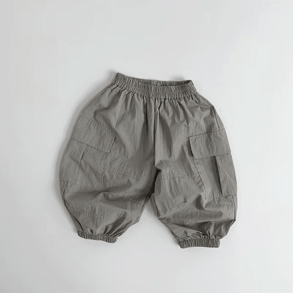 Gray organic baby bloomers with elastic waist and side pockets, soft fabric for everyday comfort