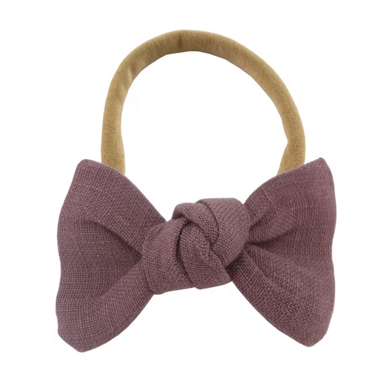 Soft organic baby headband with mauve knotted bow and mustard band