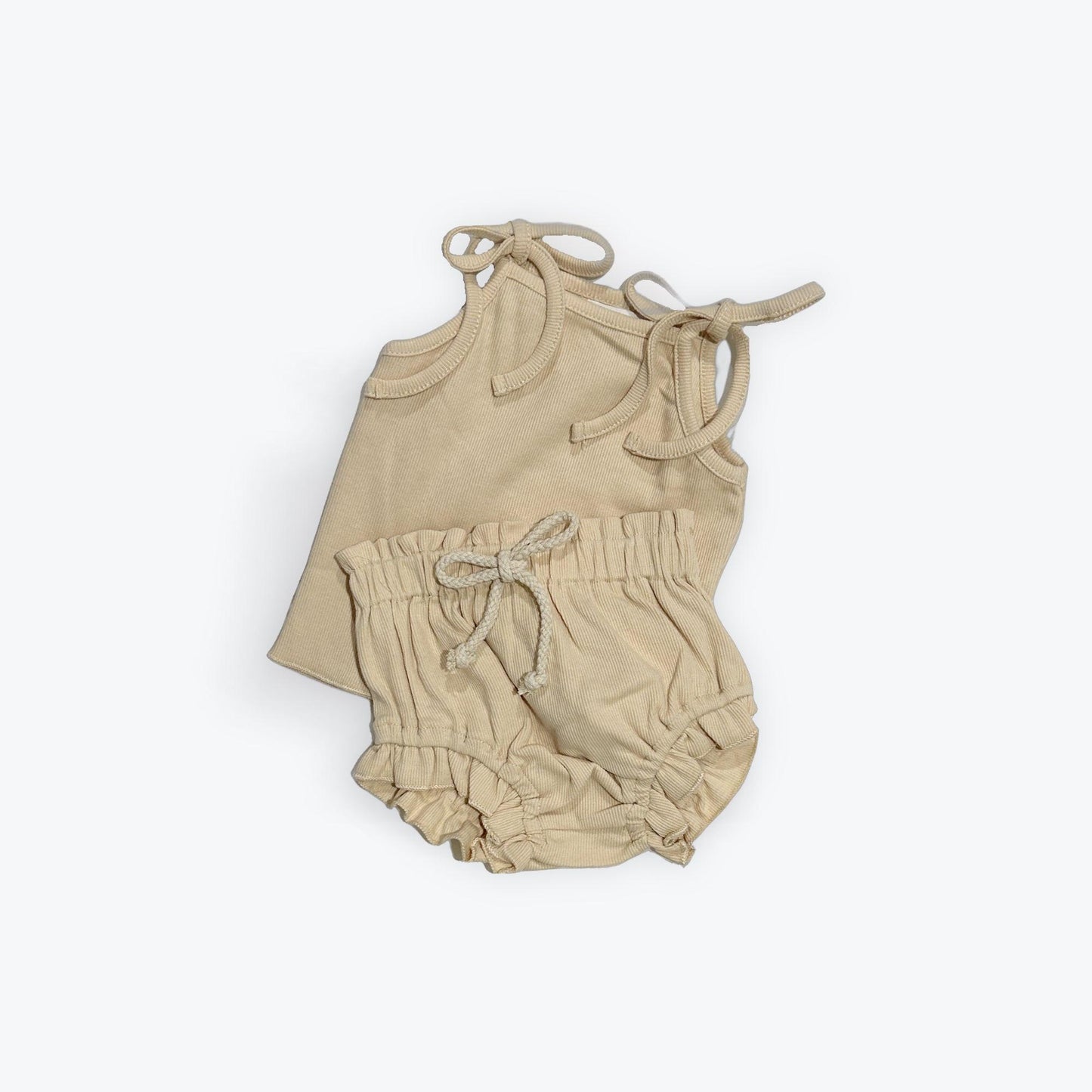 Beige organic baby clothing set with tie-shoulder top and elastic waist bloomer, certified organic by Casita Bebes.