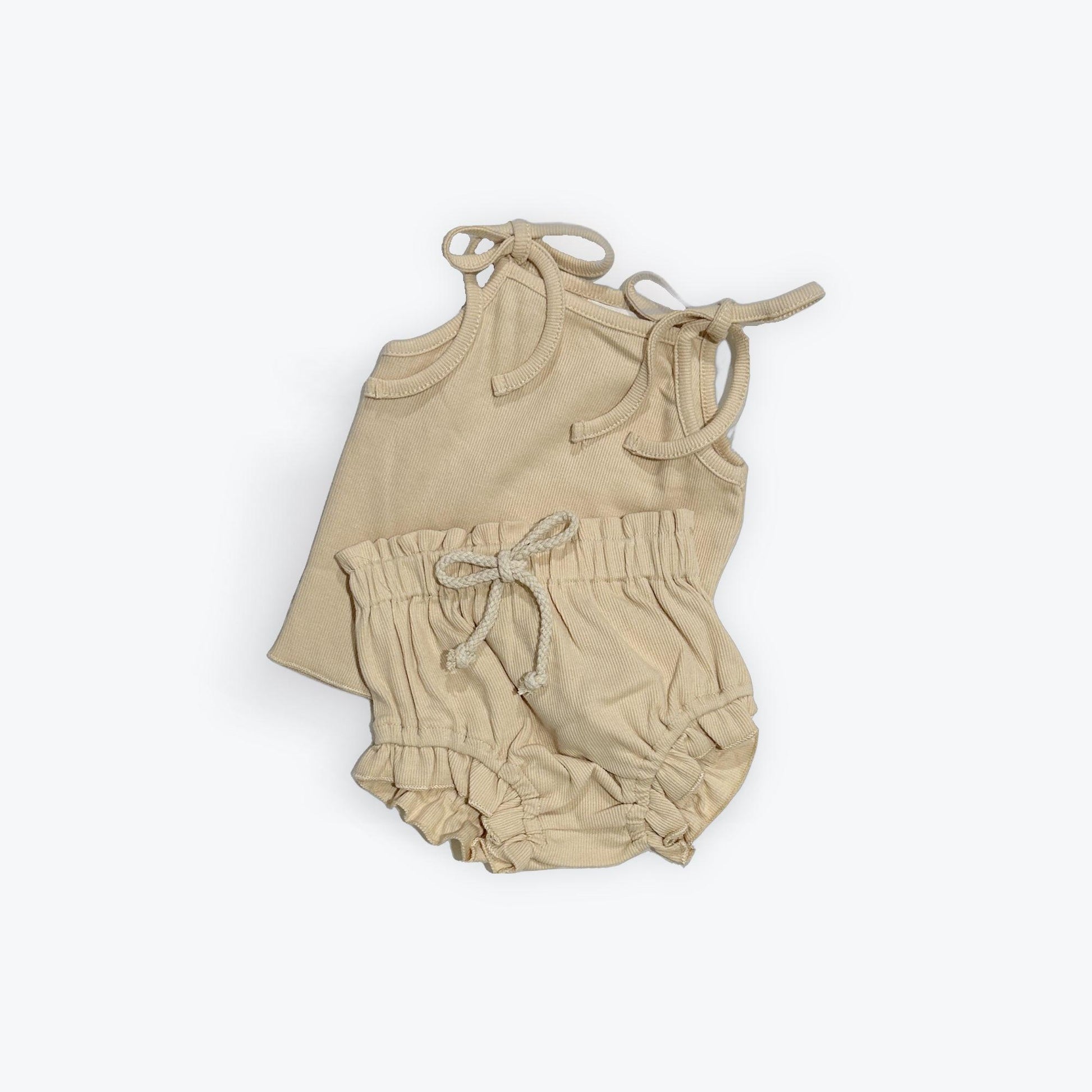 Beige organic baby clothing set with tie-shoulder top and elastic waist bloomer, certified organic by Casita Bebes.