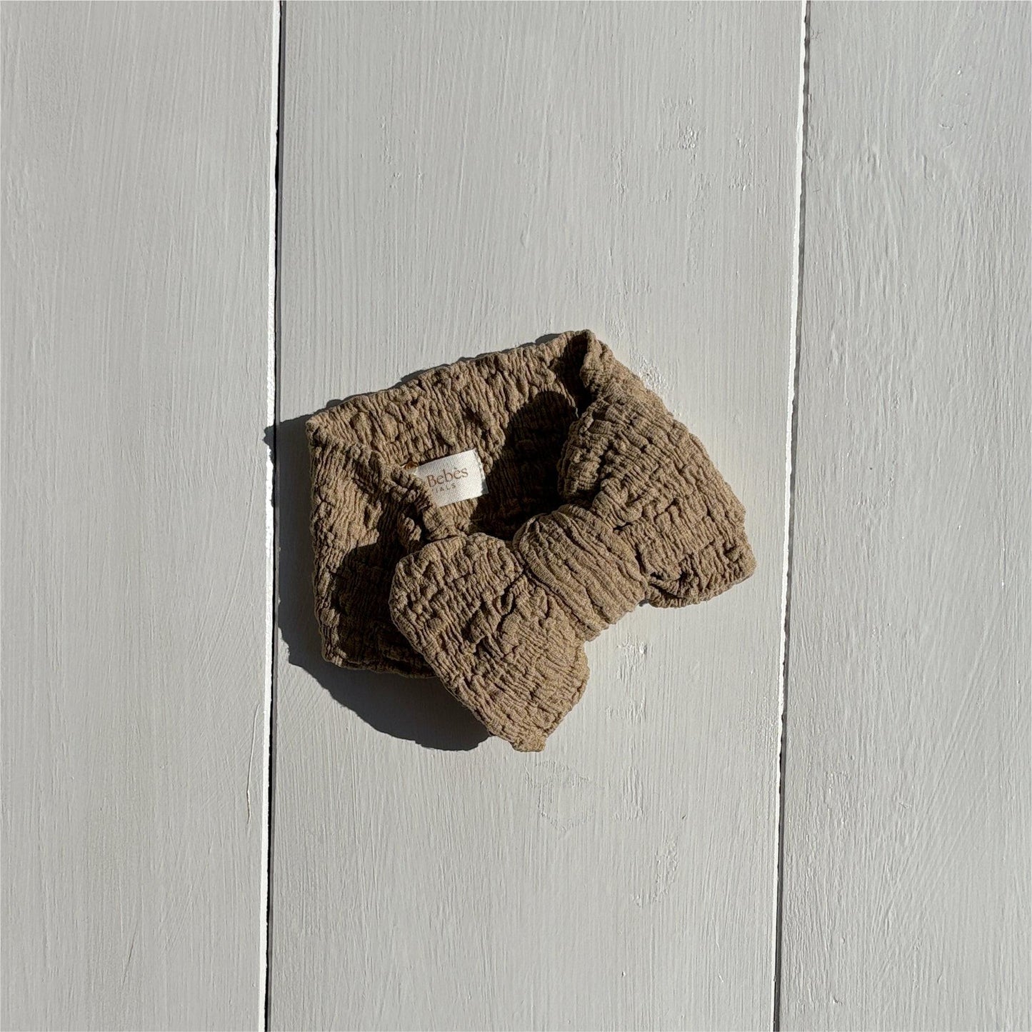Dusty khaki textured bow made from certified organic fabric for baby clothing by Casita Bebes.