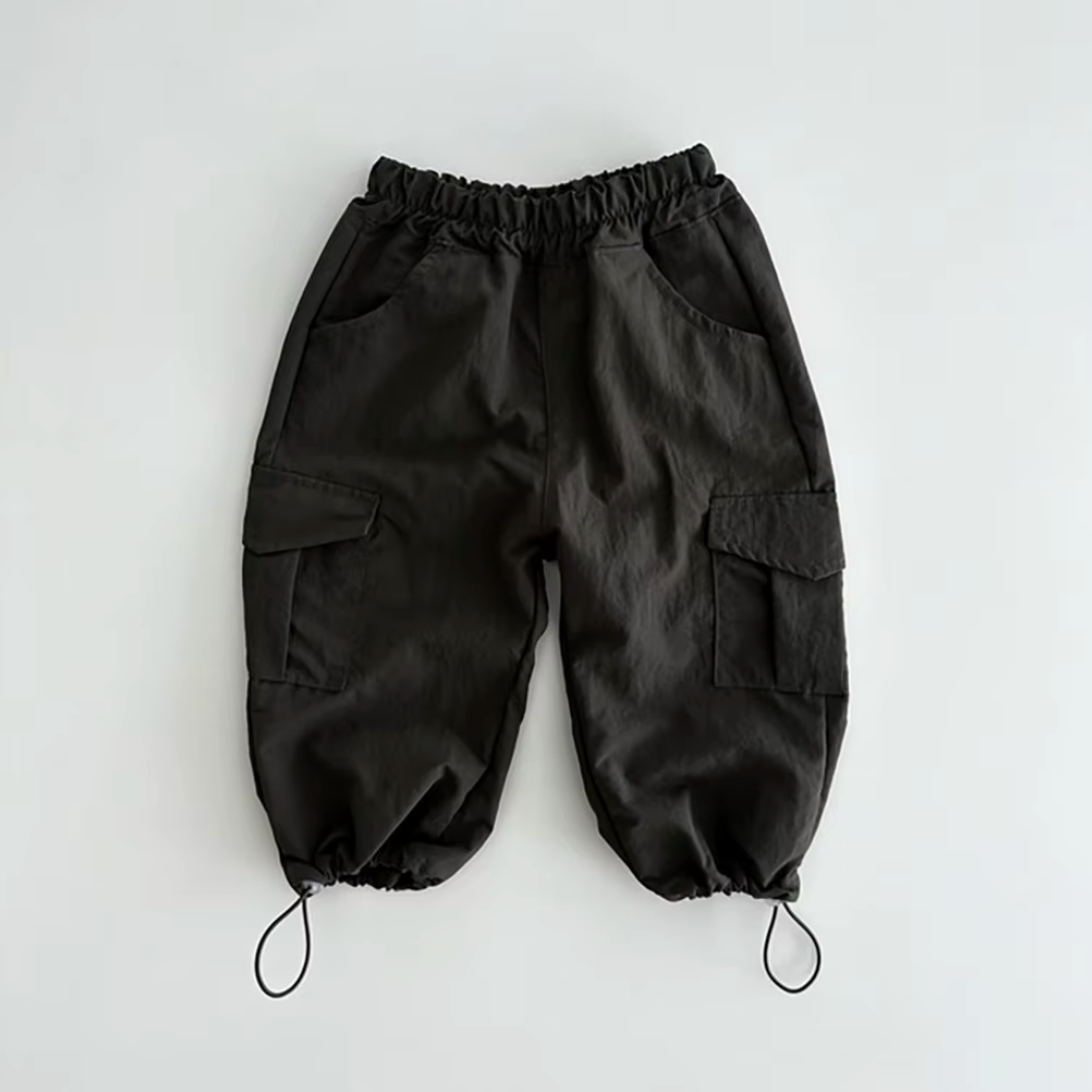 Organic black baby pants with elastic waistband and adjustable drawstring cuffs, certified organic baby clothing by Casita.