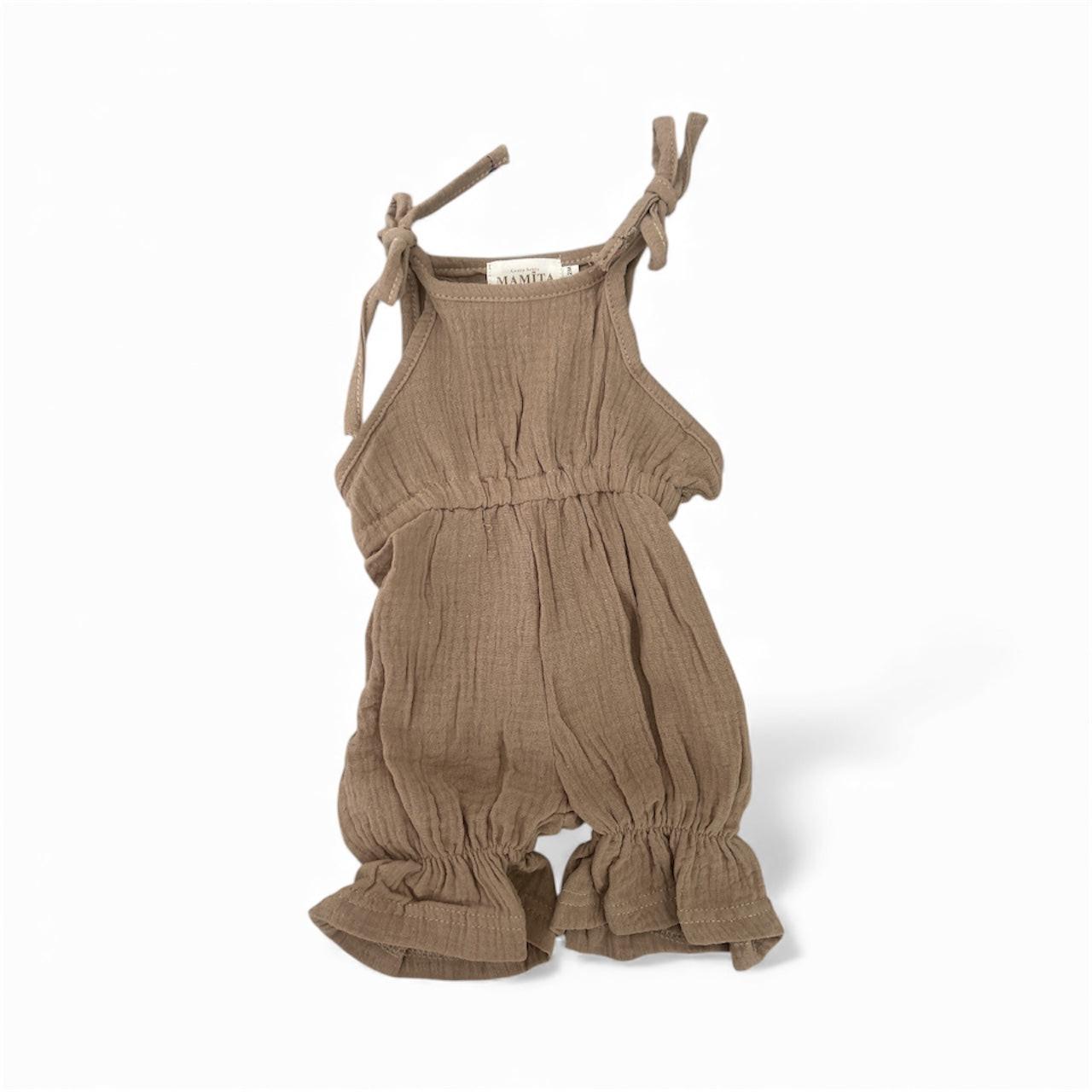 Khaki organic cotton baby jumpsuit with tied shoulder straps and gathered leg cuffs, certified organic baby clothing by.