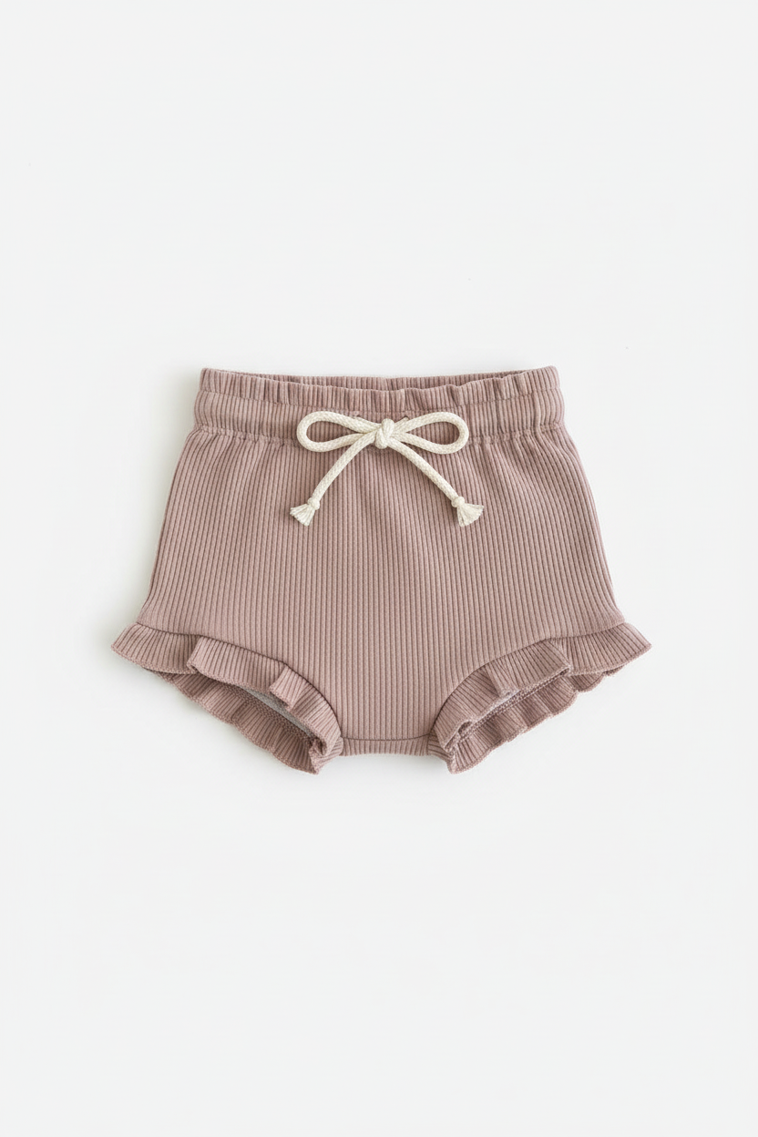 Organic dusty pink baby bloomer with ruffle edges and drawstring, Casita Bebes certified organic baby clothing.