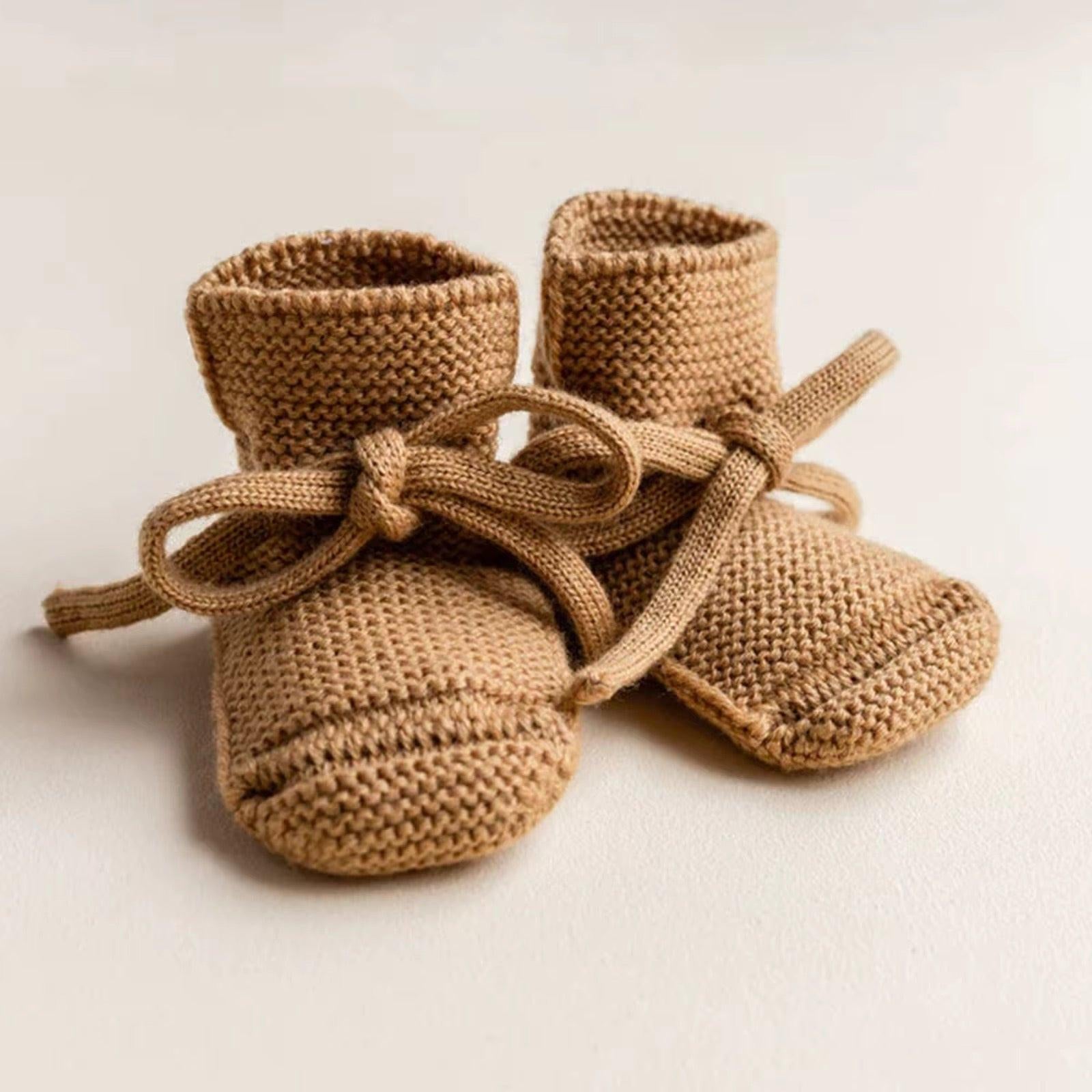 Organic dusty brown knitted baby booties with ties, certified organic baby clothing by Casita Bebes.