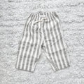 Gray and white striped baby pants on soft rug, organic cotton comfort