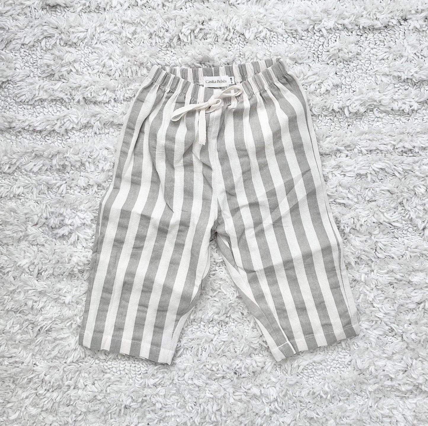 Organic dusty grey and white striped baby pants with drawstring, certified organic baby clothing by Casita Bebes.
